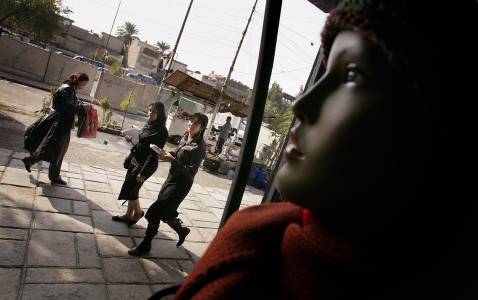 2: Iraqi women walk in